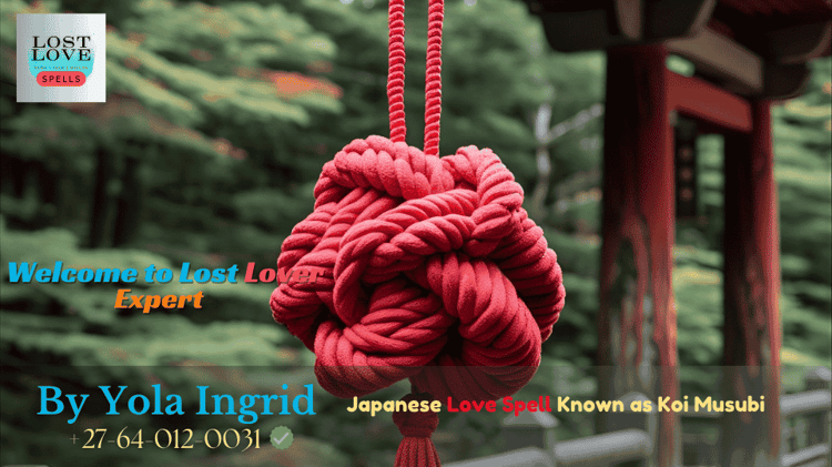 A red cord tied in a decorative knot hanging from a Shinto shrine railing
