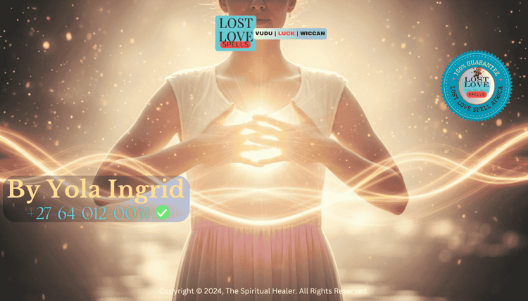 A woman surrounded by soft glowing light with hands over her heart, symbolizing energy flow during love manifestation.