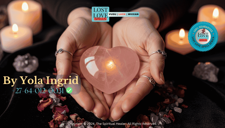 Close-up of a woman holding a rose quartz heart crystal during a love spell ceremony.