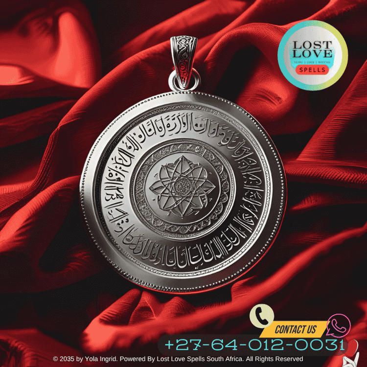 Engraved silver amulet inscribed with Quranic verse placed on red cloth