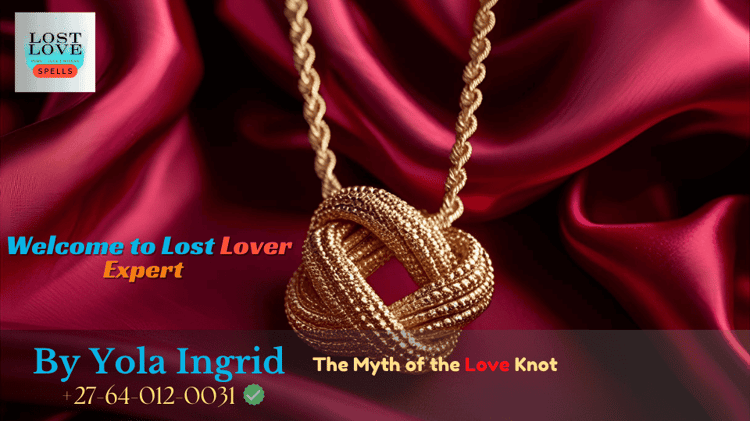 Golden love knot necklace on a red silk background