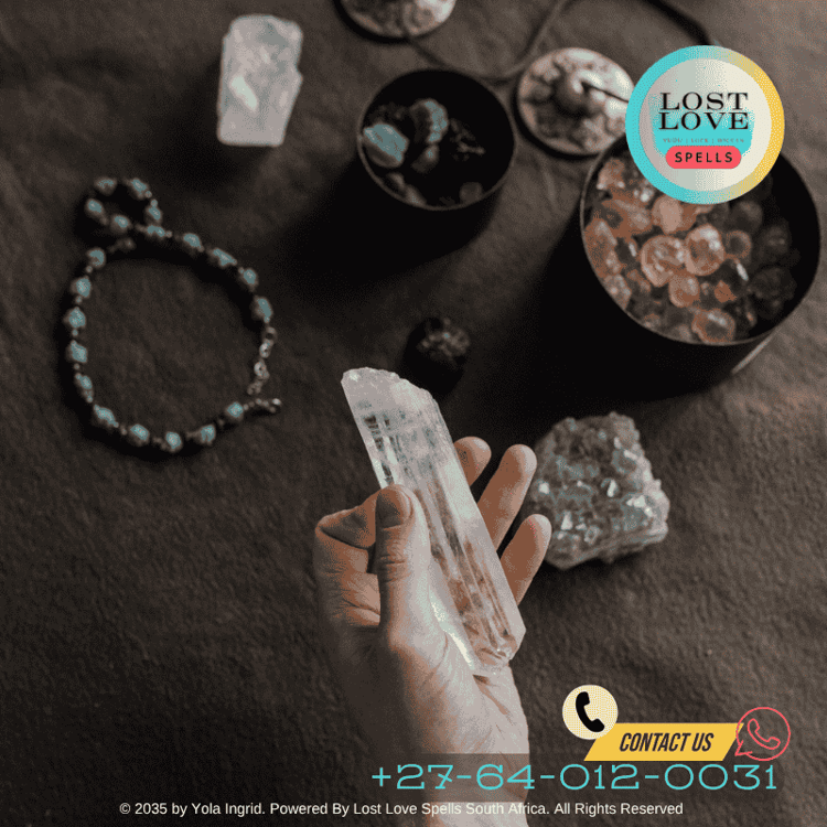 Hands holding rose quartz crystal next to a journal and full moon in background