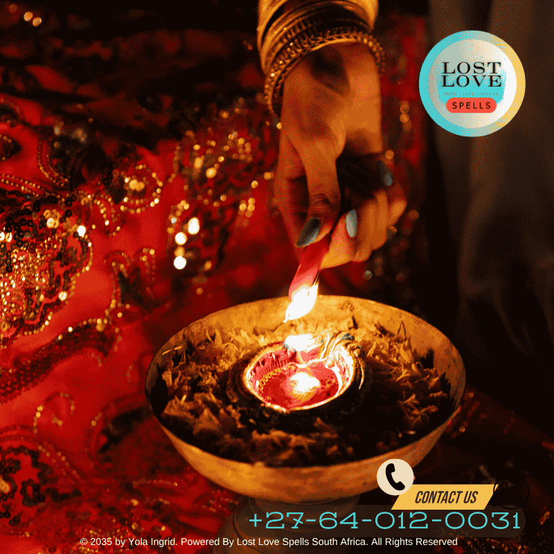 Indian woman performing a Vashikaran ritual with flowers and a diya lamp