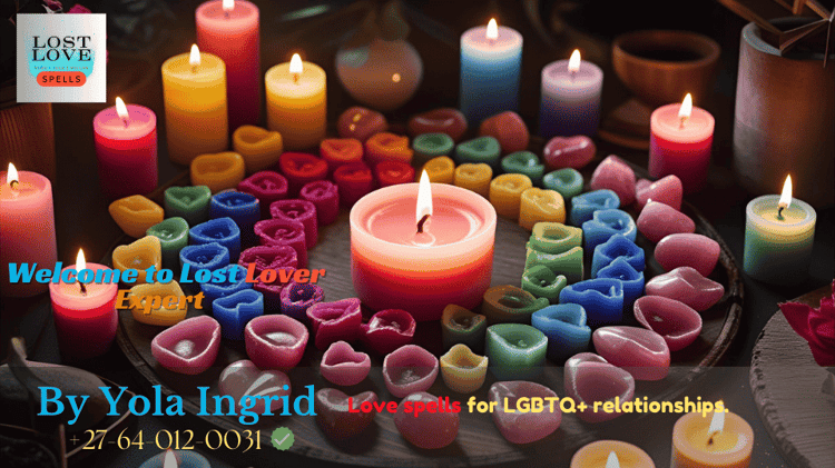 Rainbow candles and rose quartz arranged for an LGBTQ+ love ritual