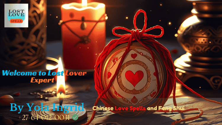 Red thread tied around a love charm near a candle and incense burner (1)