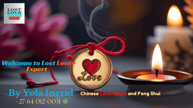 Red thread tied around a love charm near a candle and incense burner