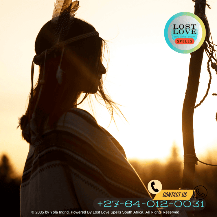 Shamanic woman using sweetgrass and feathers in love blessing ritual (1)