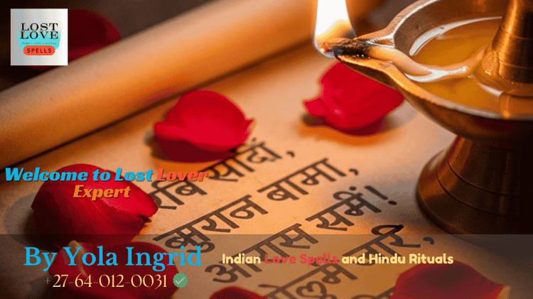 Vashikaran mantra script placed beside a ghee lamp and red rose petals